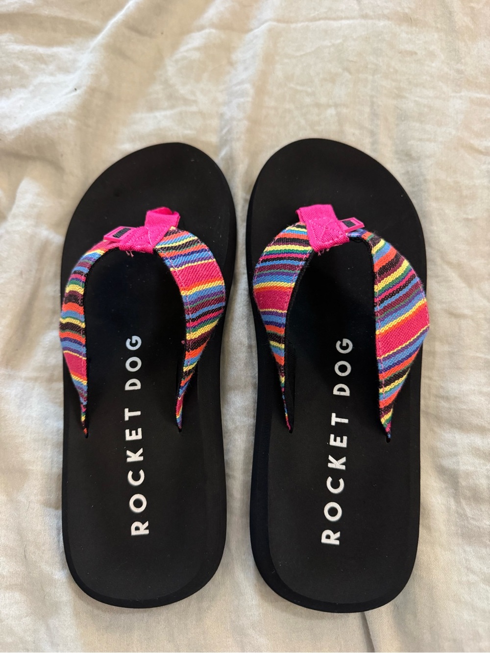 Rocket Dog Black Flip Flops with Multicolor Striped and Hot Pink Accents